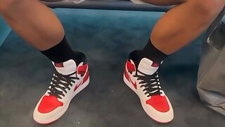 Straight guy waiting at airport doesn't know his cock is peeping through his shorts...