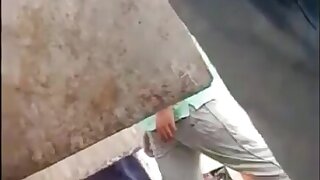 Indian pissing in public urinal