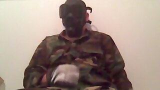 Gasmasked man wanking and beating off