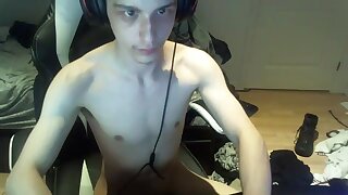 He takes a small break from gaming and jerks off and cums