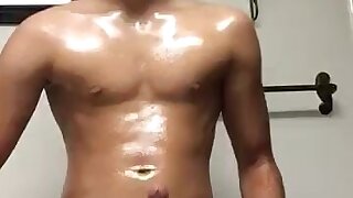 Oiled Latino with big cock wanks and cums