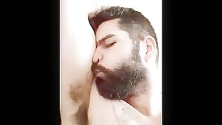 Hairy bearded hunk sniffing own pit