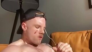 A guy with a mustache jerks off and cums on his face