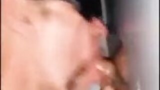 Multiple amateur scenes from a video store back room series of booths, including sucking,, fucking, and shared booths.