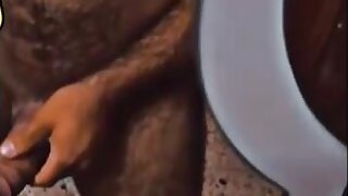 Hairy Arab makes selfie at mirror