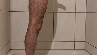 Hairy man takes a shower