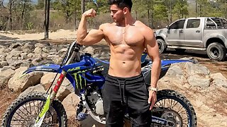 Watch this muscular motocross bro at the track.